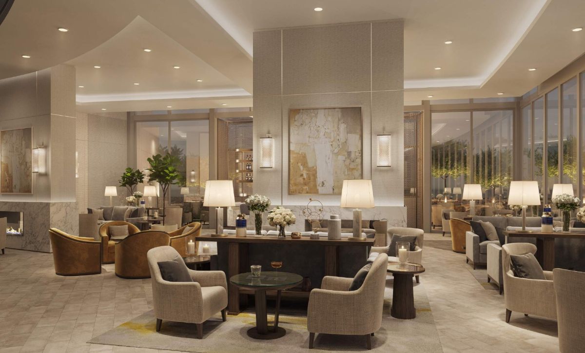 A luxurious hotel lobby featuring elegant decor, plush seating, and sophisticated lighting, inviting guests to relax and unwind.
