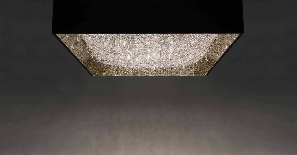 A square light fixture featuring a stunning crystal chandelier, adding elegance and sparkle to any room's decor.