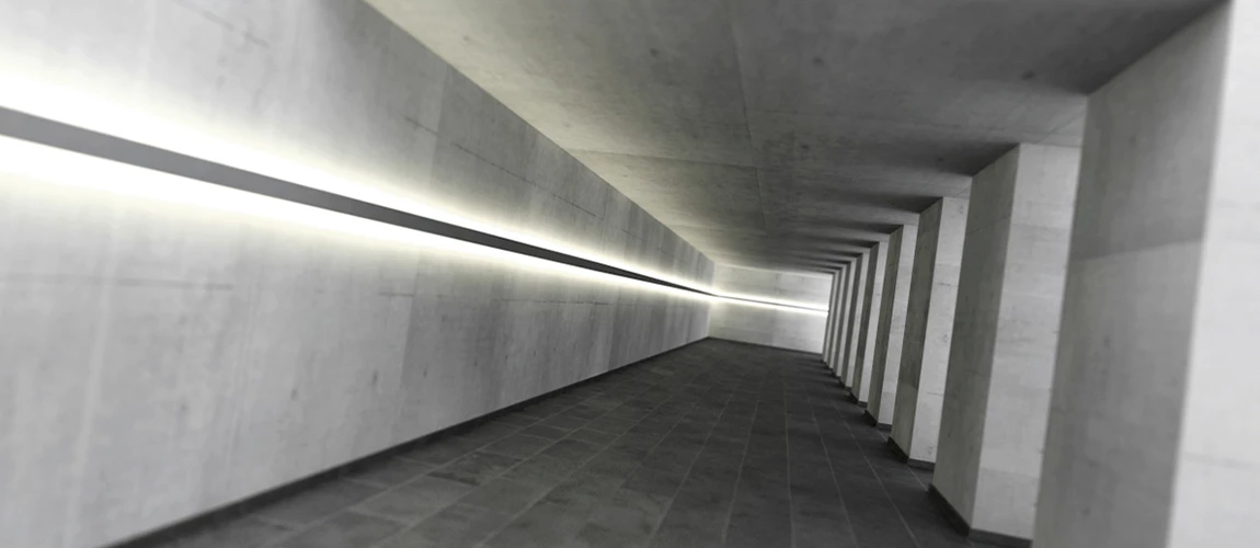  A long, bright hallway featuring white walls and a soft light illuminating the space, creating a serene atmosphere.